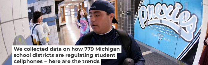 A student uses the unlocking mechanism as he leaves school for the day. Keith Srakocic/AP Photo